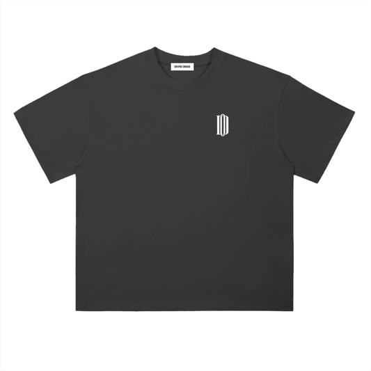 Black t-shirt with a small white logo on a white background