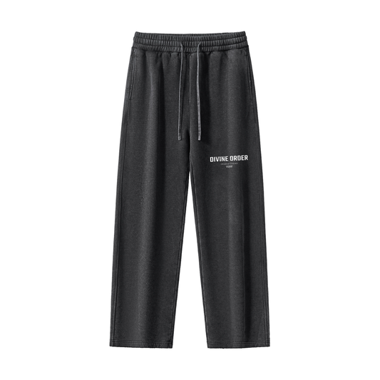 Black sweatpants with 'Divine Order' logo on a white background